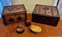 Group shot showing dowry chest, star box and three puzzle boxes