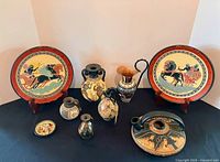 All items overview: two plates on stands, five vessels in front