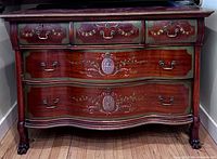 Full frontal view of dresser showing overall design, finish, curves and feet