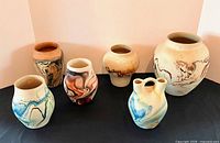 Group shot of all six Nemadji pottery vases