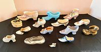 Group shot of all miniature shoes on black surface