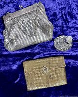 All three Whiting & Davis items: silver handbag, gold clutch, silver rosary pouch