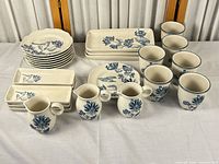 Entire 28-piece dinnerware set displayed on table