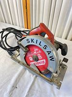 Overall view of circular saw showing Skilsaw guard, Diablo blade, cord, and handle