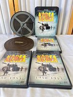 DVD cases, collector tin, film reel and metal can overview