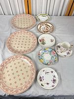 Group shot of plates, saucers and teacup