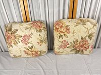 Both floral chair cushions front view