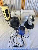 Group shot of all six devices with cords visible