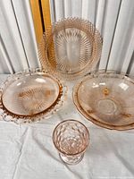 Group shot showing all five pink glass pieces