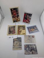 Full lot view with eight sleeved basketball cards