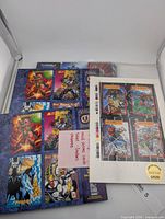 Stack of uncut sheets and cards including SkyBox Milestone limited edition sheet and ShadowHawk cards