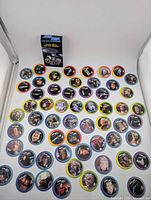 Full layout of 58 pogs arranged with storage case