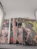 Stack of bagged comics, showing mix of Willow and Donna Mia titles