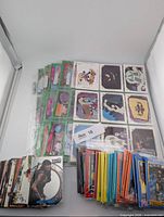 Assorted stacks of Xena, Beetlejuice and sealed Halloween trading cards