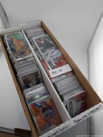 Two-row card box filled with sleeved NBA cards