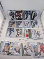 All 30 rookie cards displayed in sleeves