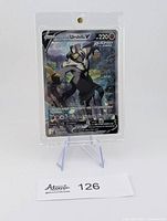 Front view of Rapid Strike Urshifu V card in screw-down plastic case on stand