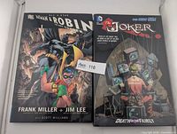Front covers of both hardcover graphic novels inside box