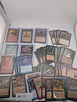Overview of the 50+ Magic: The Gathering cards laid out in tray