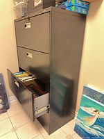 Cabinet left side view with one drawer open showing hanging file rails