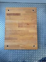 Full view of rectangular butcher block showing overall size and four corner holes