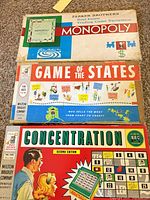 Top view of all three board game boxes