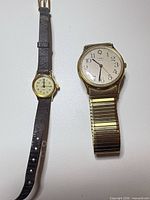 Front view of both Timex wristwatches showing dial designs and bands