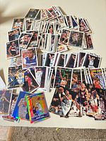 Wide view of mixed Topps NBA cards spread out on table
