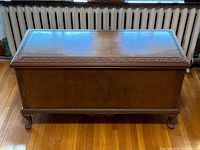 front view of walnut cedar-lined chest on cabriole feet