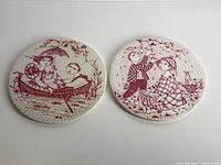 Both round plaques front view