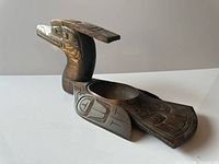 Left side view of carved cedar loon bowl