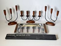 Overall lot showing three candelabras, tray, Dansk candle package