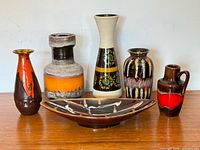 Front view of five vases and bowl