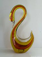 Full view of glass swan showing color layers and dimensions