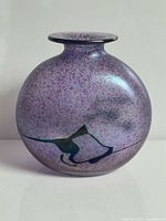 Front view of purple mottled art glass vase