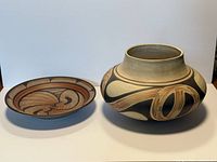 Jar and bowl side by side showing relative sizes and designs