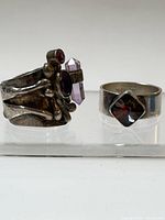 Front view of both rings showing stone settings and band designs