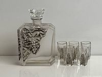 Decanter with added replacement stopper and four glasses frontal view
