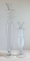 Both glass candle holders full view showing relative height