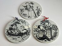 Three round Bjørn Wiinblad illustrated ceramic trivets