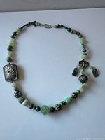 Full view of jade and silver bead necklace