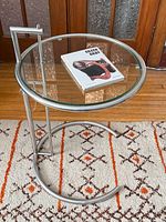 Table with book on glass top showing overall design