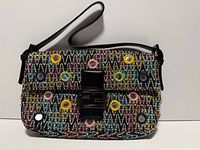 Front view of Fendi baguette showing multicolour zigzag fabric, grommets and buckle