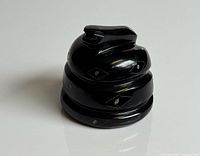 front angle of the carved black obsidian coiled snake figurine showing head and body