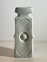 Front view of white bisque modernist vase