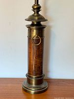 Close-up of base and column showing materials and missing ring accent