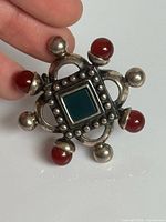 Front view of brooch showing design and stones