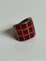 Angled view showing red enamel grid and band profile