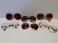 Six pairs of vintage eyewear laid out