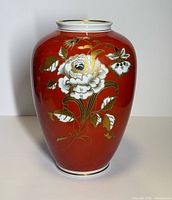Full front view of red Wallendorf floral porcelain vase